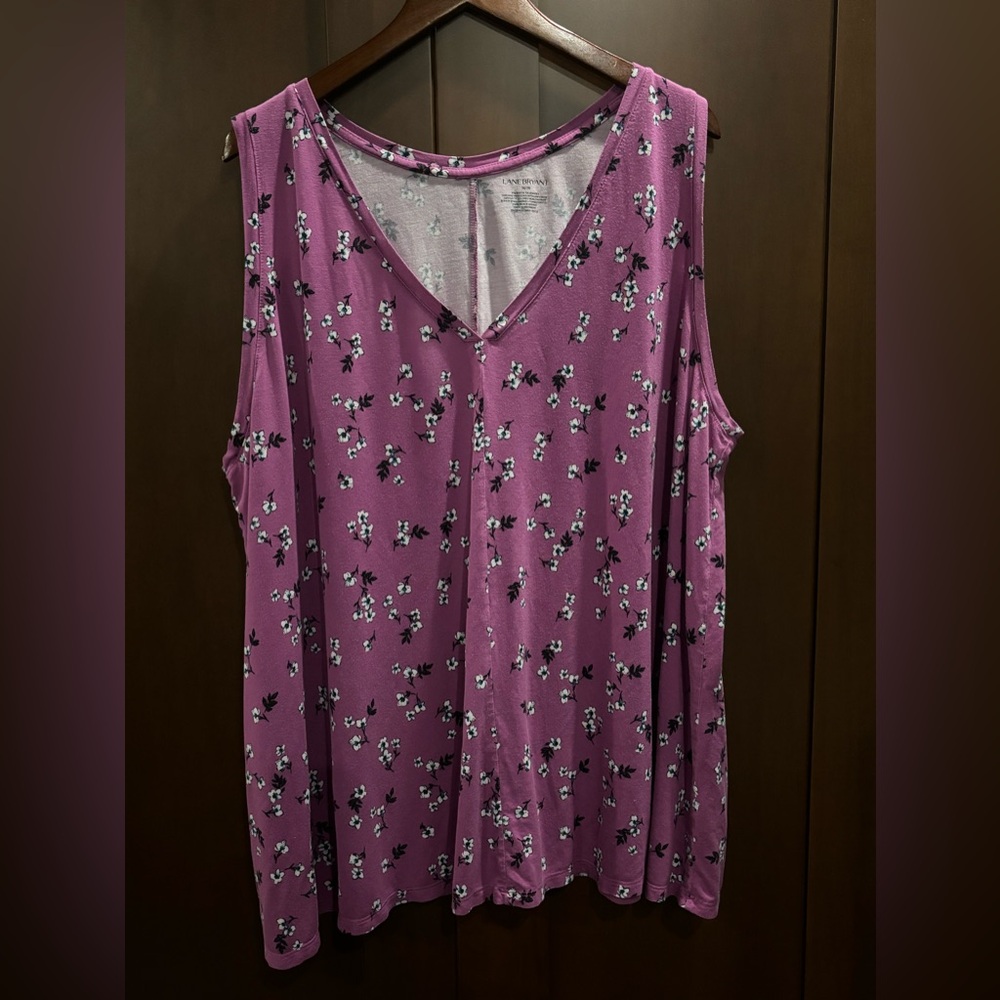 Long tank with fun floral print on purple tee material.